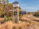 Stone monument at Lakeview Pointe entrance with lush landscaping and signage at 10159 Lakeshore Dr, Lancaster, SC 29720