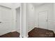 View of the entryway showing hardwood floors, white walls and trim, and two entry doors at 10159 Lakeshore Dr, Lancaster, SC 29720