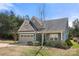 Charming single-Gathering home with a two-car garage, stone accents, and lovely curb appeal at 10159 Lakeshore Dr, Lancaster, SC 29720