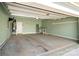 Spacious garage with white door, utility sink, and ample space for storage and parking at 10159 Lakeshore Dr, Lancaster, SC 29720