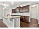 Beautiful kitchen with stainless steel appliances, dark wood cabinetry, and granite countertops at 10159 Lakeshore Dr, Lancaster, SC 29720