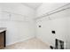 This laundry room features wire rack shelving and washer dryer hookups and tile flooring at 10159 Lakeshore Dr, Lancaster, SC 29720