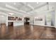 Bright living area with hardwood floors, coffered ceilings, and an open concept design at 10159 Lakeshore Dr, Lancaster, SC 29720