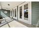 Covered patio featuring multiple french doors, stylish rug, and a ceiling fan at 10159 Lakeshore Dr, Lancaster, SC 29720