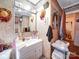 Bathroom featuring patterned wallpaper and a white vanity with mirror at 1043 Ridge Ave, Gastonia, NC 28052