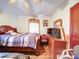 Bedroom featuring hardwood floors, ceiling fan, and a dresser with a TV at 1043 Ridge Ave, Gastonia, NC 28052