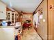 A cozy dining area attached to the kitchen, featuring wood paneling and tile flooring at 1043 Ridge Ave, Gastonia, NC 28052