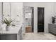 Elegant bathroom with double vanity, marble flooring, and laundry access at 107 Hillside Cove Ct, Mooresville, NC 28117