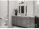 Bathroom with gray vanity, quartz countertop, and decorative tile accent on the shower at 107 Hillside Cove Ct, Mooresville, NC 28117