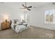 Cozy bedroom features plush carpet, large windows, and serene ambiance at 107 Hillside Cove Ct, Mooresville, NC 28117