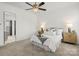Bright bedroom offers a ceiling fan, plush carpet, and a peaceful retreat at 107 Hillside Cove Ct, Mooresville, NC 28117