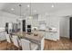 Modern kitchen with white cabinetry, stainless steel appliances, and a large island with seating for casual dining at 107 Hillside Cove Ct, Mooresville, NC 28117