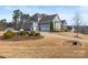 Home exterior with attached garage and landscaped yard at 107 Hillside Cove Ct, Mooresville, NC 28117