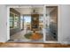 Charming screened-in porch features a stone fireplace, rocking chairs, and a peaceful outdoor view at 107 Hillside Cove Ct, Mooresville, NC 28117
