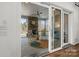 This relaxing screened-in porch offers a stone fireplace, comfortable seating, and access to outdoor living at 107 Hillside Cove Ct, Mooresville, NC 28117
