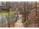 Walkway to lake access with canoes and kayaks stored lakeside at 107 Hillside Cove Ct, Mooresville, NC 28117
