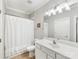 Clean bathroom featuring a vanity with great lighting, a shower and a toilet at 1121 Park West Dr, Charlotte, NC 28209