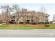 Exterior shot of condo building, showcasing the well-maintained landscaping, and beautiful design at 1121 Park West Dr, Charlotte, NC 28209