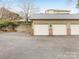 Spacious garages with brick accents, offering ample parking and storage at 1121 Park West Dr, Charlotte, NC 28209