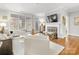 Bright living room with a fireplace, hardwood floors, and comfortable seating at 1121 Park West Dr, Charlotte, NC 28209