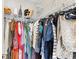 Organized walk-in closet featuring wire shelving and hanging clothes at 1121 Park West Dr, Charlotte, NC 28209