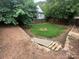 Backyard with fence and a fire pit area at 115 6Th Ne Ave, Hickory, NC 28601