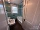 Vintage bathroom featuring a toilet, sink, tub, and medicine cabinet at 115 6Th Ne Ave, Hickory, NC 28601