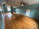 Spacious bedroom with hardwood floors, teal paint, and natural light at 115 6Th Ne Ave, Hickory, NC 28601