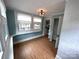 Charming dining room with built in shelves, natural light, and hardwood floors at 115 6Th Ne Ave, Hickory, NC 28601