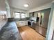 Modern kitchen with stainless steel appliances, light cabinetry, and attractive backsplash at 115 6Th Ne Ave, Hickory, NC 28601