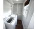 Bright laundry room with built in shelving, storage and a window at 115 6Th Ne Ave, Hickory, NC 28601