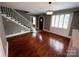 Spacious living room with hardwood floors, stairway access, and window light at 115 6Th Ne Ave, Hickory, NC 28601