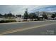 Street view of a shopping center lined with businesses and ample parking at 115 6Th Ne Ave, Hickory, NC 28601