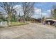 Large backyard with multiple outbuildings, offering plenty of space for storage and hobbies at 117 Maple Hill Rd, Monroe, NC 28110
