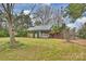 Beautiful single story home with well-maintained lawn and mature trees surrounding the property at 117 Maple Hill Rd, Monroe, NC 28110