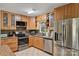 Kitchen with stainless steel appliances and a view from the window at 117 Maple Hill Rd, Monroe, NC 28110
