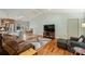 Open living room with hardwood floors, TV, and comfortable seating at 117 Maple Hill Rd, Monroe, NC 28110