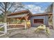 Outbuilding and covered structure featuring a picnic table, enhancing outdoor living and dining at 117 Maple Hill Rd, Monroe, NC 28110