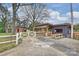 Property featuring an outbuilding and covered structure with a picnic table, enhancing outdoor entertaining at 117 Maple Hill Rd, Monroe, NC 28110