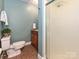 Cozy bathroom featuring a vanity with wood cabinets and a shower with decorative glass doors at 124 Canterbury Ln, Matthews, NC 28104
