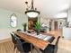 Elegant dining room showcasing a wooden table, stylish decor, and an open view into the modern kitchen space at 124 Canterbury Ln, Matthews, NC 28104