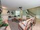 The open-concept living room showcases a fireplace, modern furniture, wooden floors, and a view of the staircase at 124 Canterbury Ln, Matthews, NC 28104