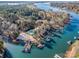 Aerial view of lake community with docks, boat slips, and a community pool at 125 High Sail Ct, Mooresville, NC 28117
