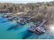Overhead shot of boats in marina with lake and woods surrounding the property at 125 High Sail Ct, Mooresville, NC 28117