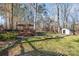 Expansive backyard with a wooden deck, pergola, and shed at 125 High Sail Ct, Mooresville, NC 28117