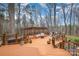 Spacious backyard featuring an outdoor living area and natural tree coverage at 125 High Sail Ct, Mooresville, NC 28117