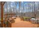 Large backyard deck featuring a pergola, stainless steel grill, and outdoor seating at 125 High Sail Ct, Mooresville, NC 28117