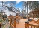 Wide angle backyard deck featuring a hot tub, pergola, fire pit, and outdoor seating at 125 High Sail Ct, Mooresville, NC 28117