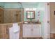 Bathroom featuring a single vanity, walk in shower, and neutral toned tile at 125 High Sail Ct, Mooresville, NC 28117