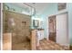 A bathroom features a tiled walk-in shower with a skylight at 125 High Sail Ct, Mooresville, NC 28117